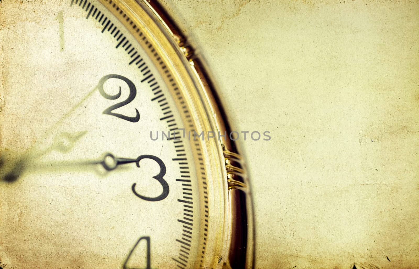 Old styled gold pocket watch on scarlet silk