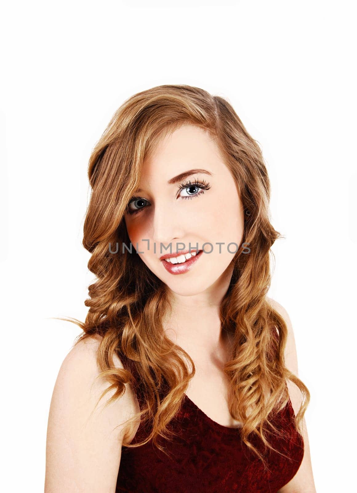 A closeup portrait picture of a young pretty teenager with long curly hair.and blue eyes, for white background..