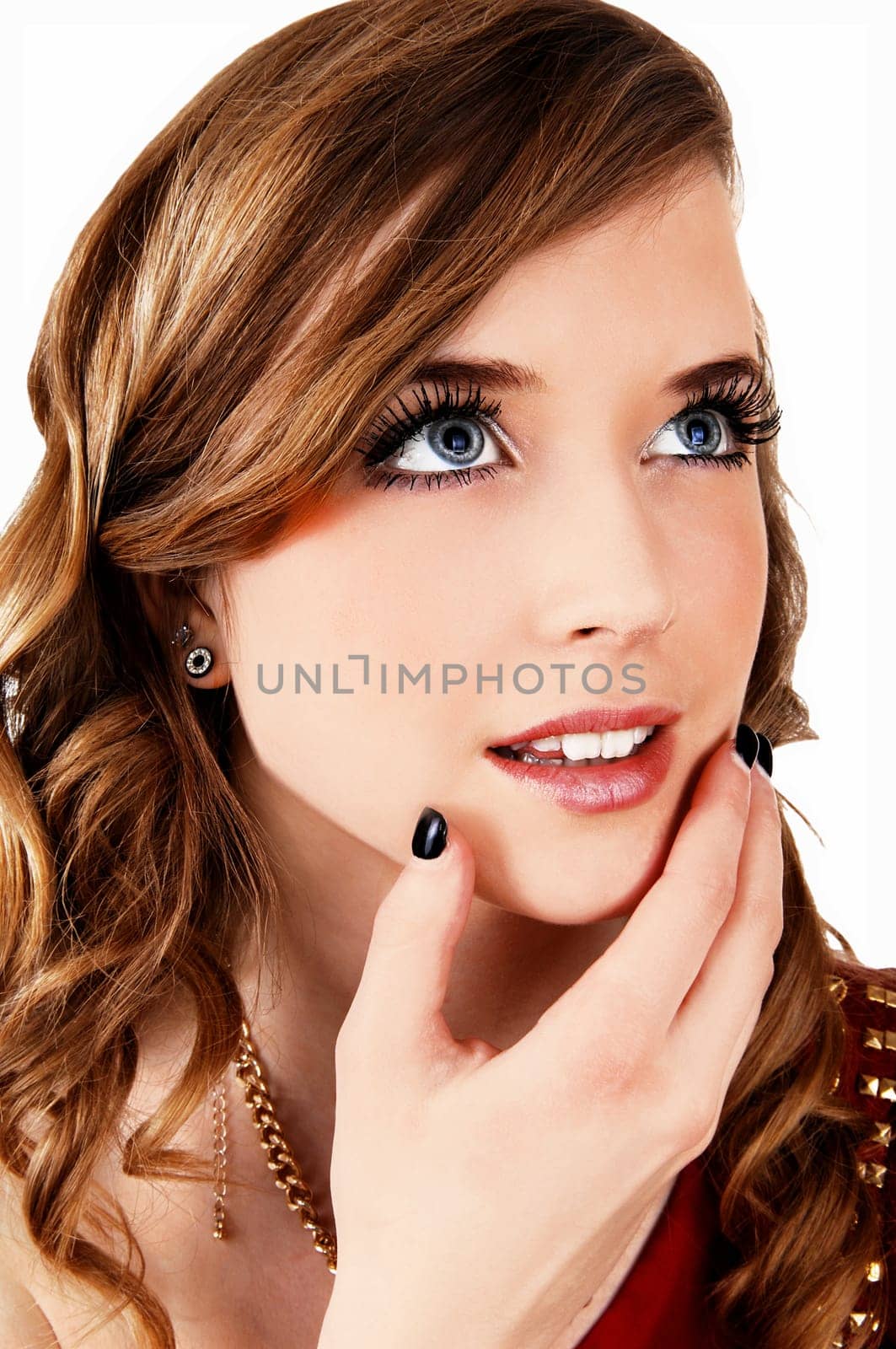 A closeup portrait picture of a young pretty teenager with long curly hair.and blue eyes looking up, for white background..