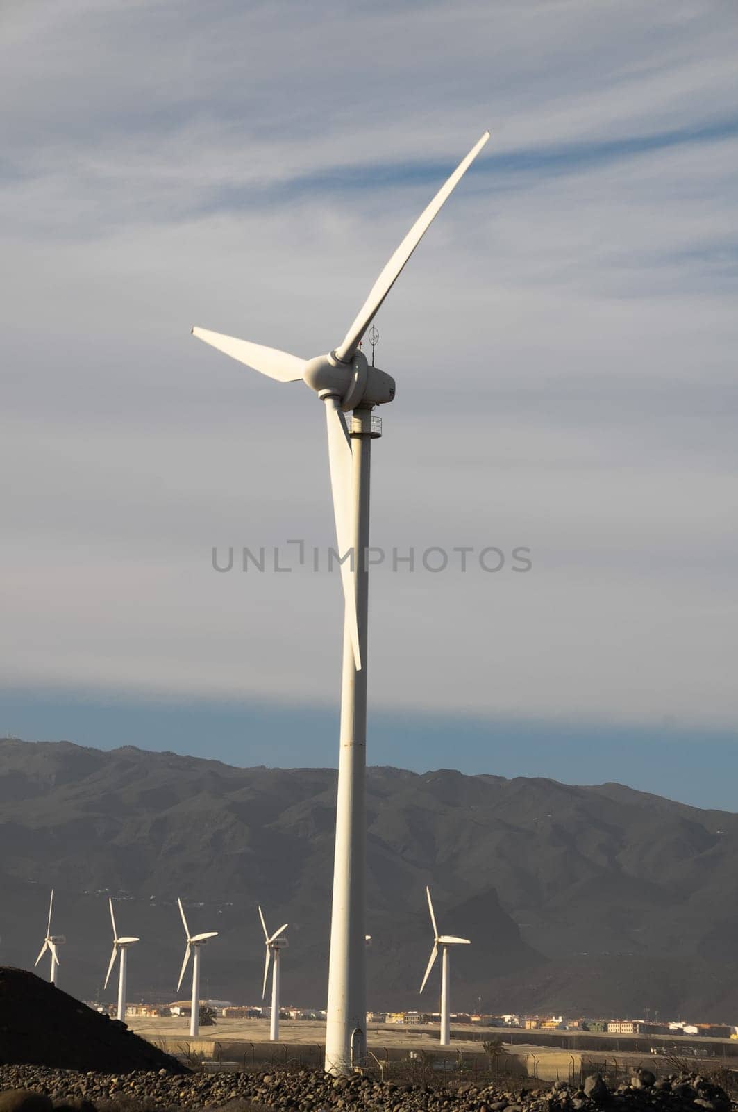 Eletric Power Generator Wind Turbine over a Cloudy Sky