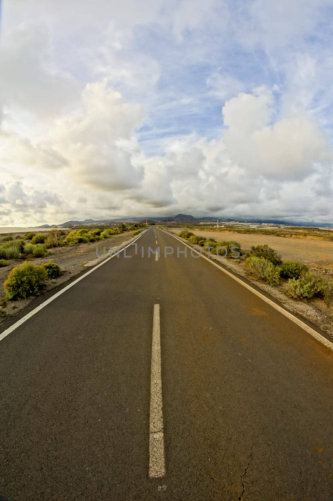 Long Empty Desert Road on a Cludy Day