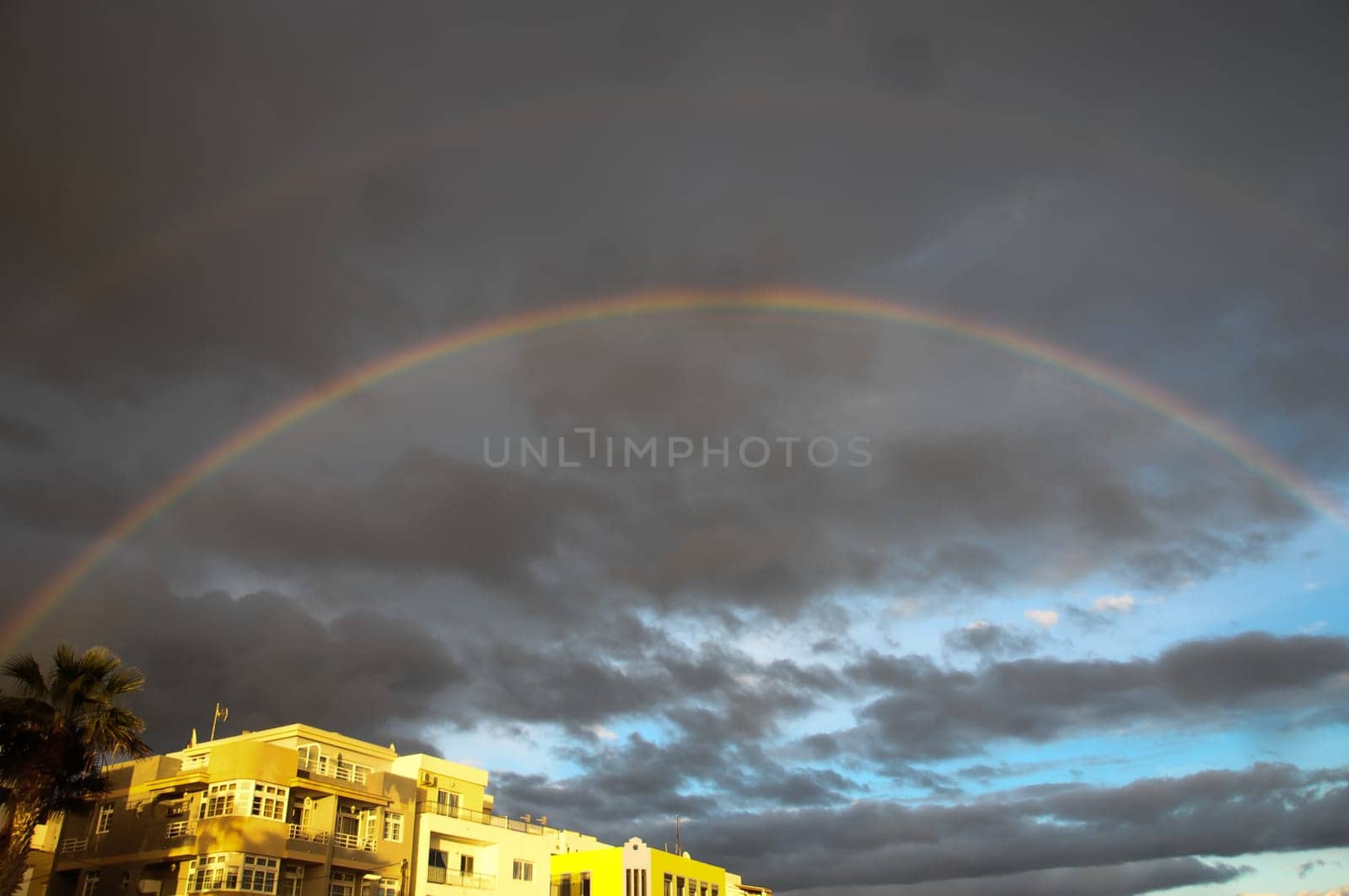 Colored Rainbow over a Cloudy Sky in Tenrife Canary Islands