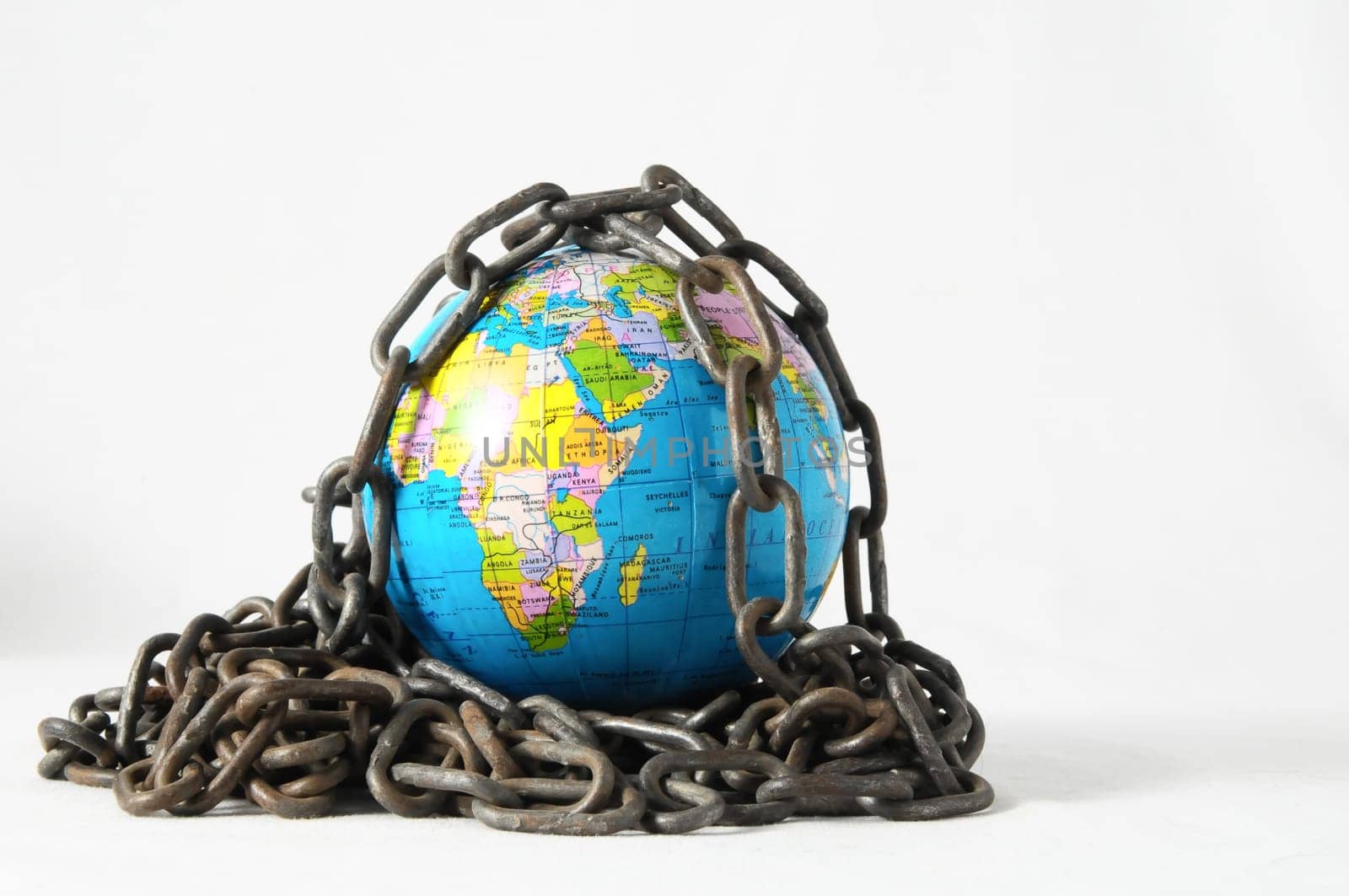 Earth globe close in chain and padlock