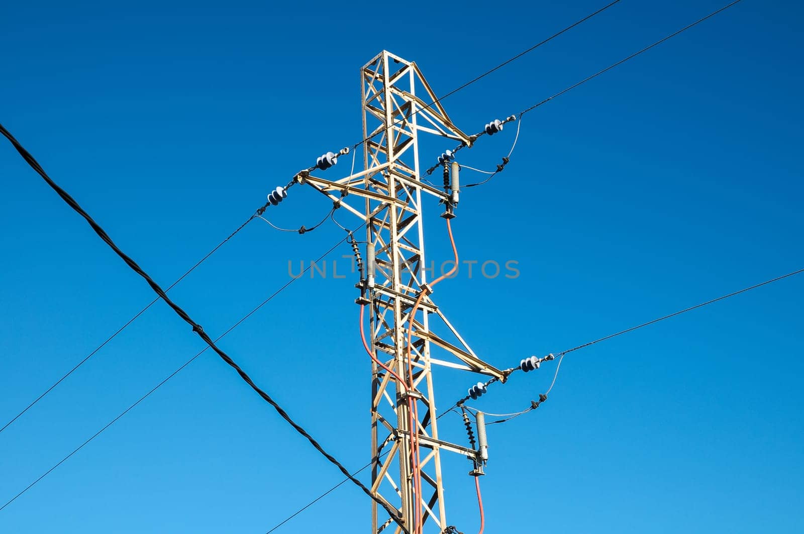 Energy Electricity Power Pylon on a Blue Sky