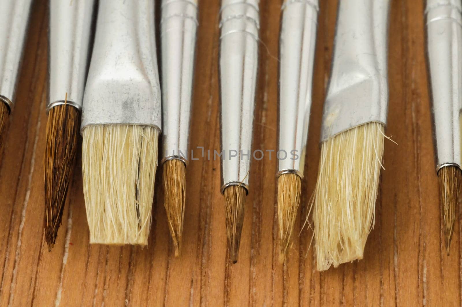 New Wooden Different Paintbrush Set Texture over a Colored Background