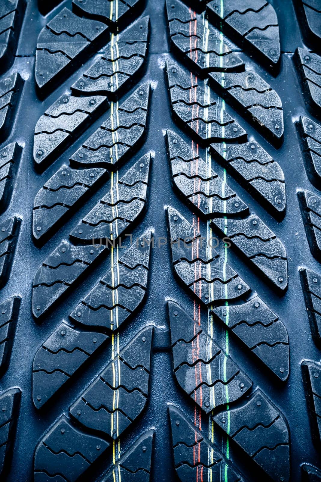 fragment of new vehicle or car tire,with visible tread and color mark.