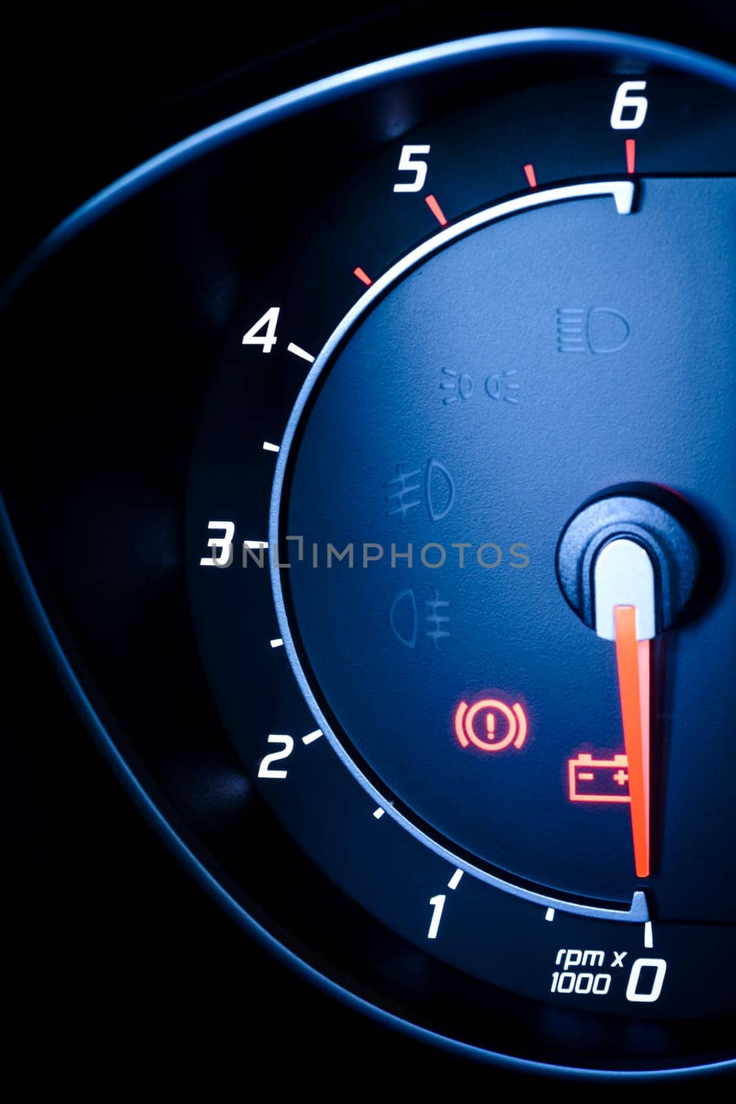 photo presents the car's vehicle's speedometer or tachometer with visible information display - ignition warning lamp and brake system warning lamp,visible symbols of the instrument cluster (this check warning light),with warning lamps illuminated.