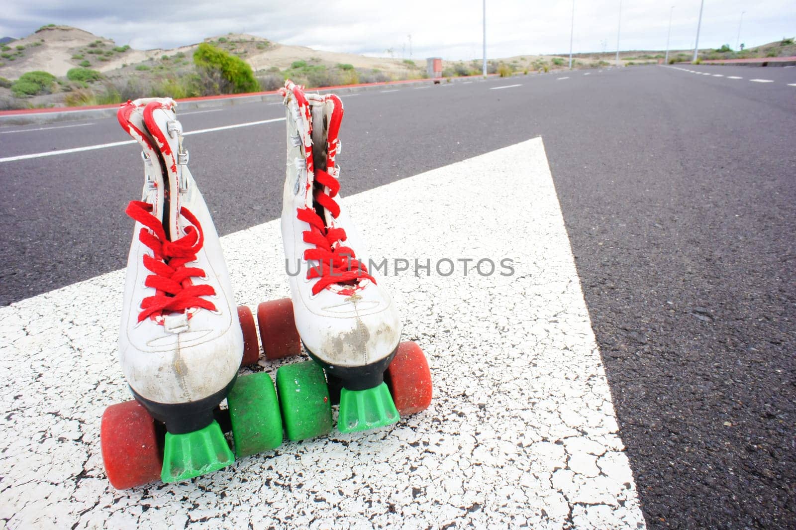 Old Vintage White Skate Boot on the Asphalt Sterret