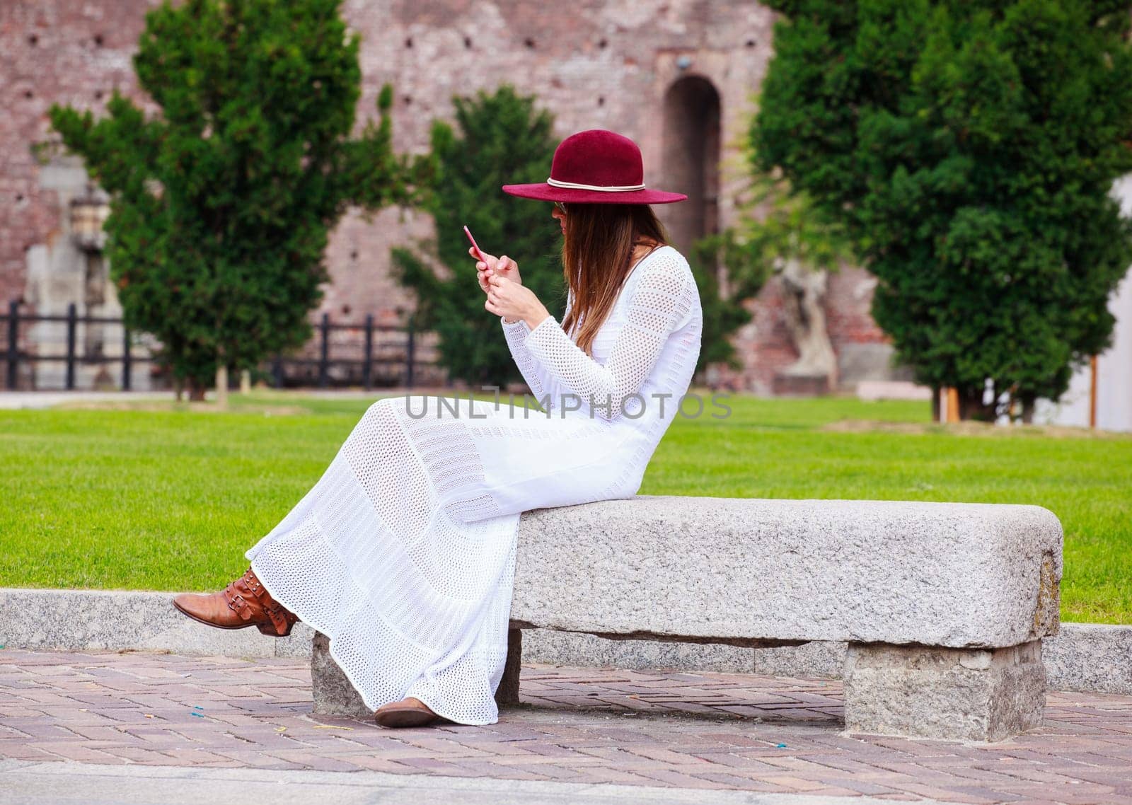 Girl in white with smartphone