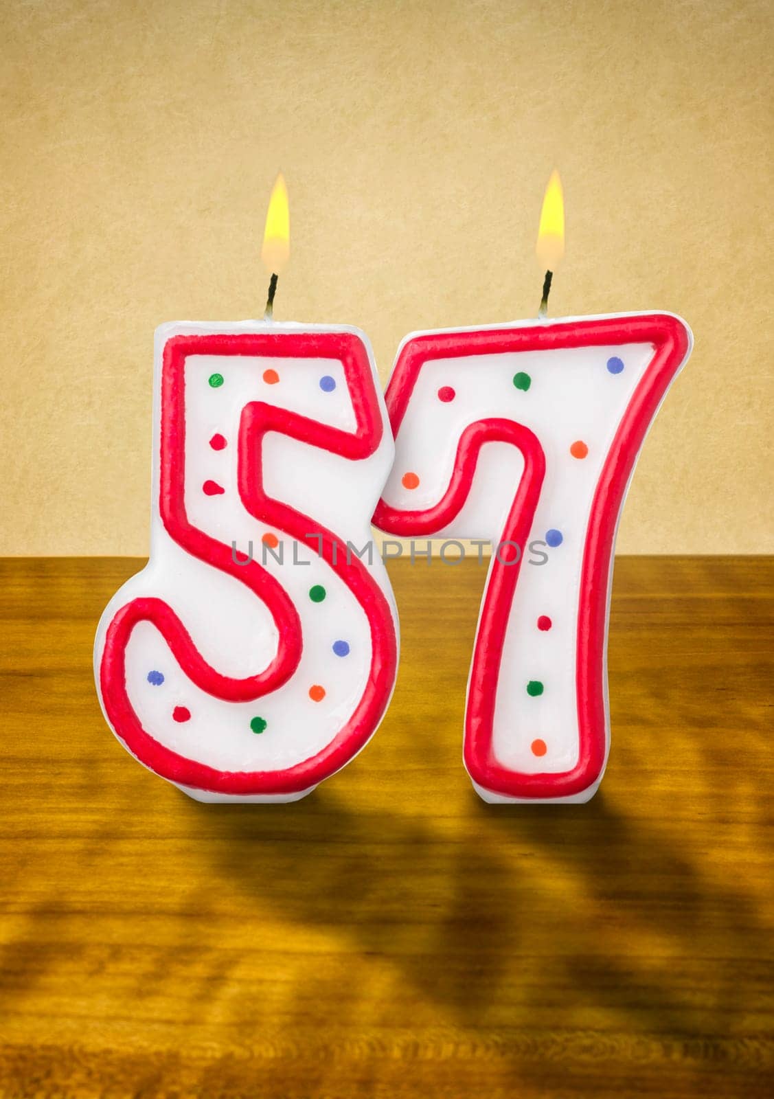 Burning birthday candles number 57