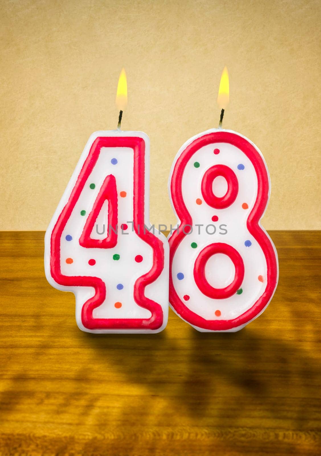 Burning birthday candles number 48