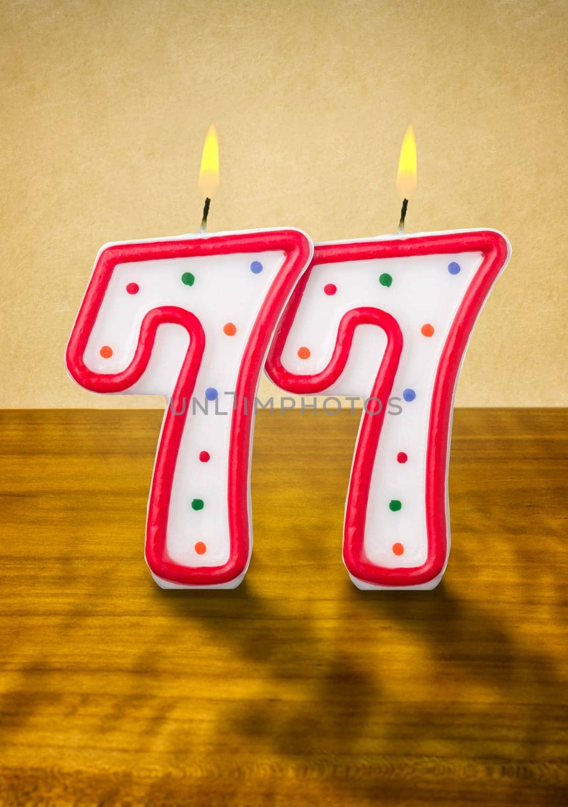 Burning birthday candles number 77