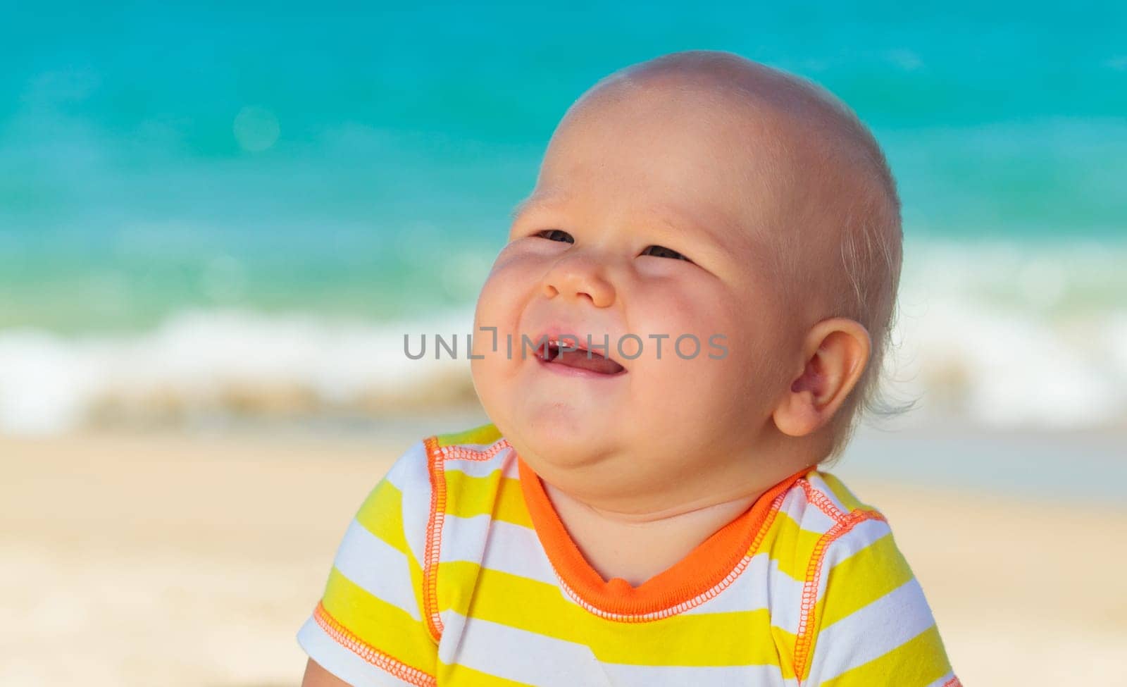 Cute baby on the tropical beach