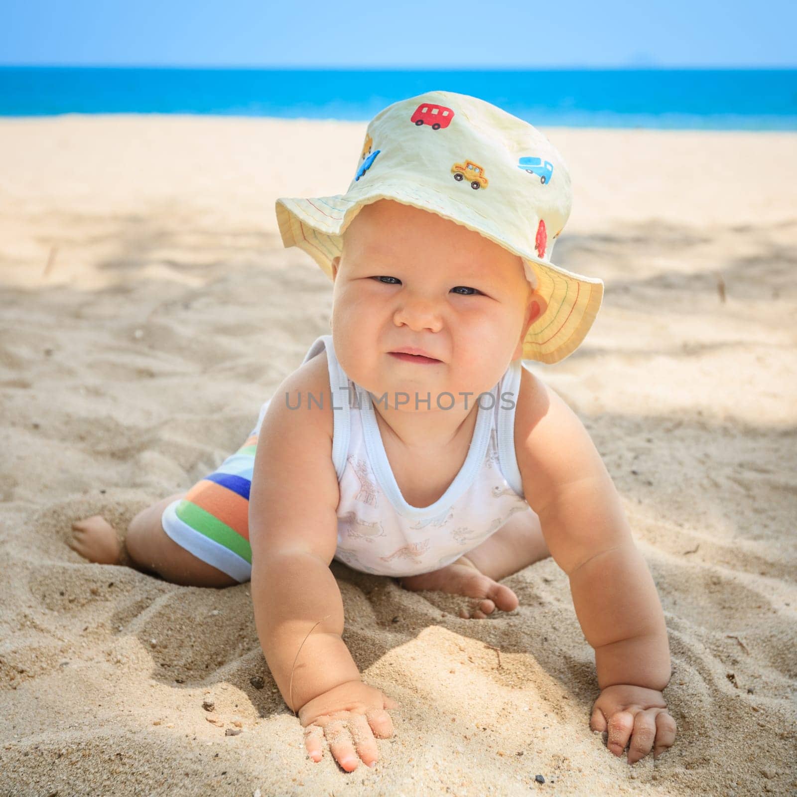Cute baby on the tropical beach