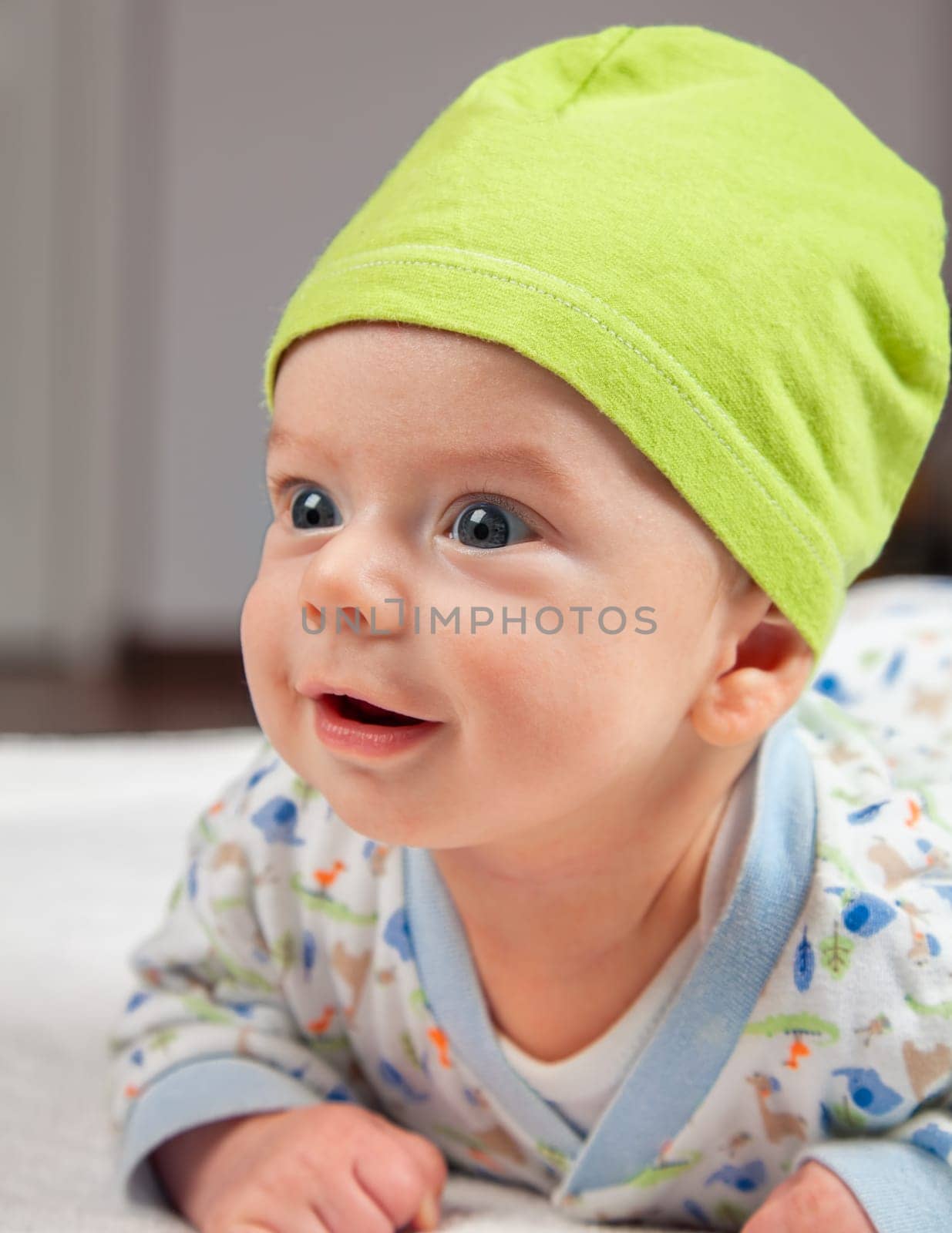 2 months baby boy doing tummy time at home.