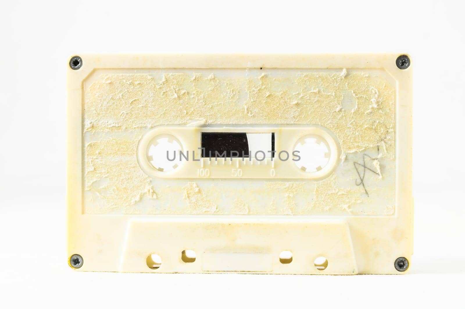 Ancient Vintage Used Musicassette over a White Background