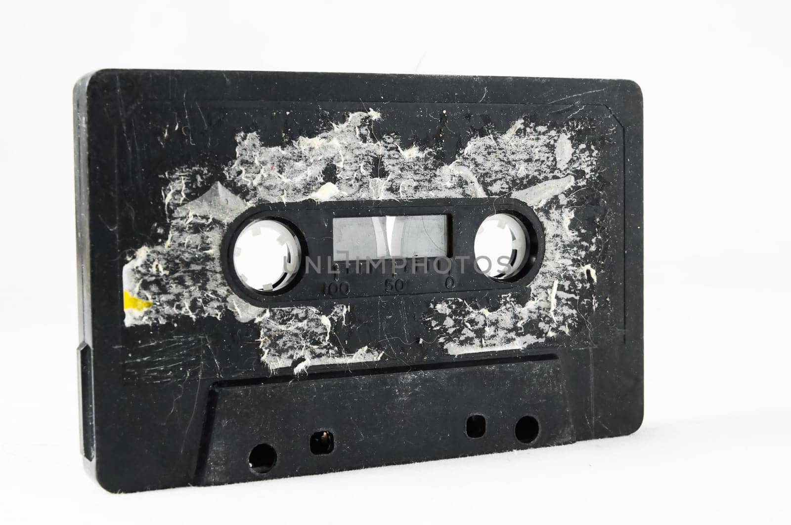 Ancient Vintage Used Musicassette over a White Background