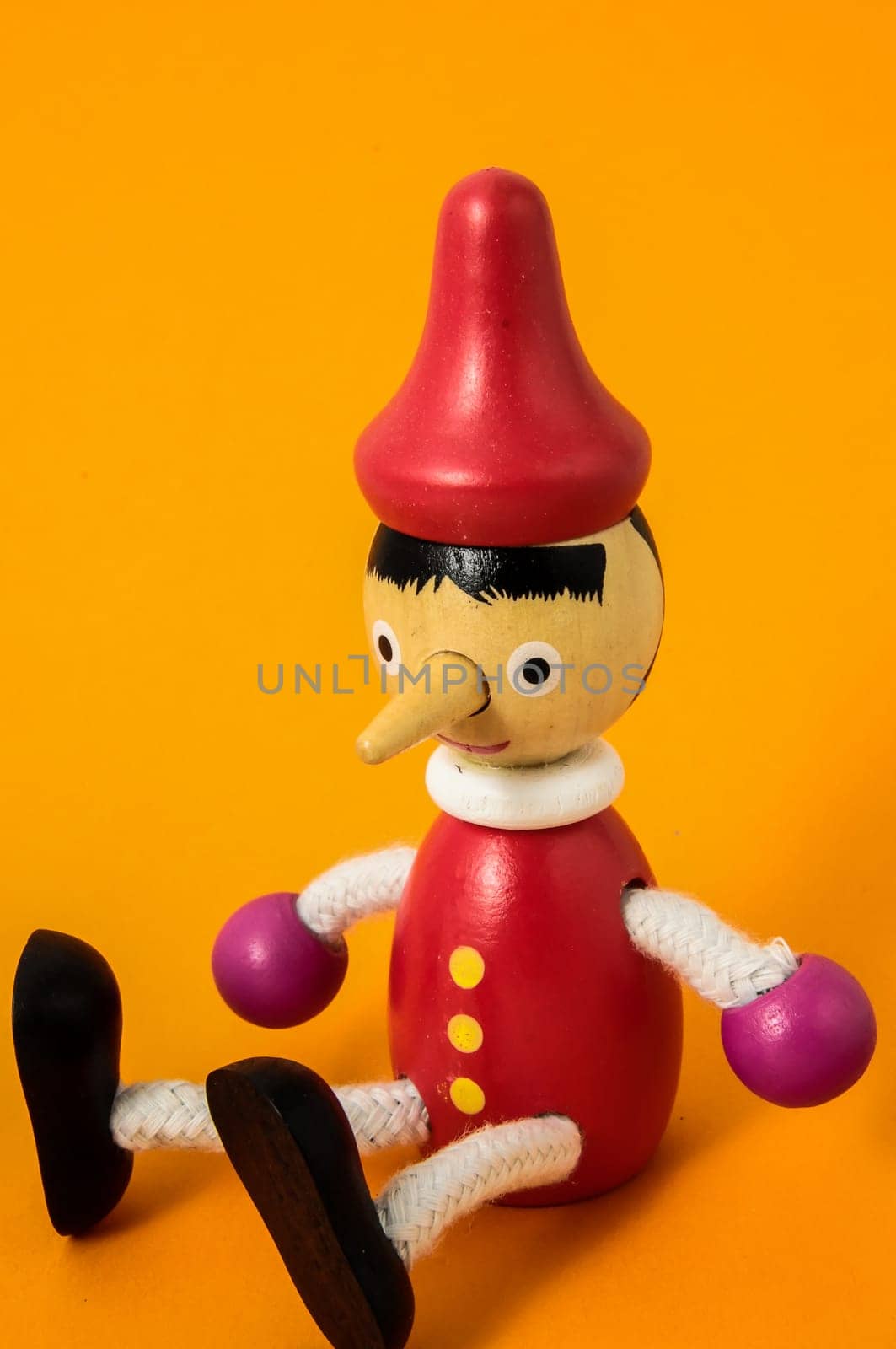 Pinocchio Toy Statue on a Colored Background