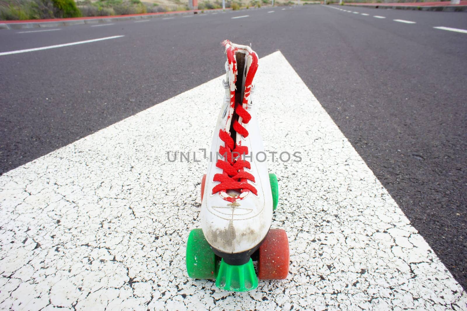 Old Vintage White Skate Boot on the Asphalt Sterret