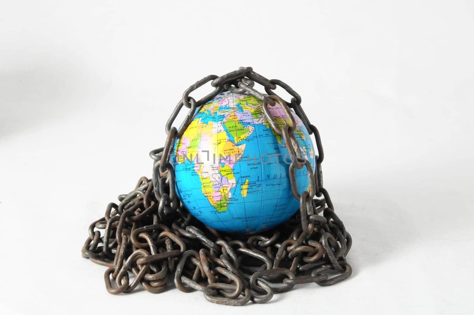 Earth globe close in chain and padlock
