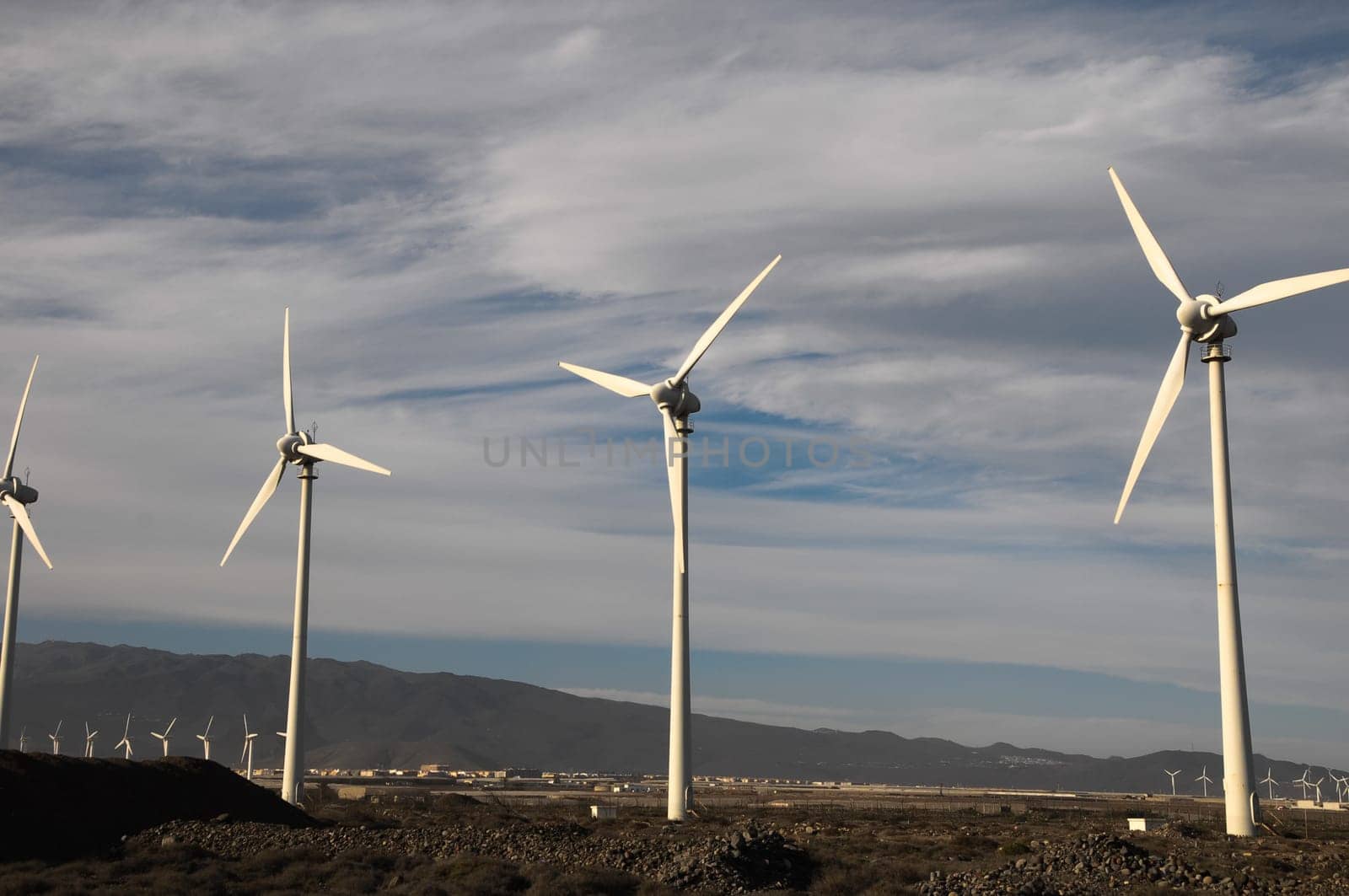 Eletric Power Generator Wind Turbine over a Cloudy Sky