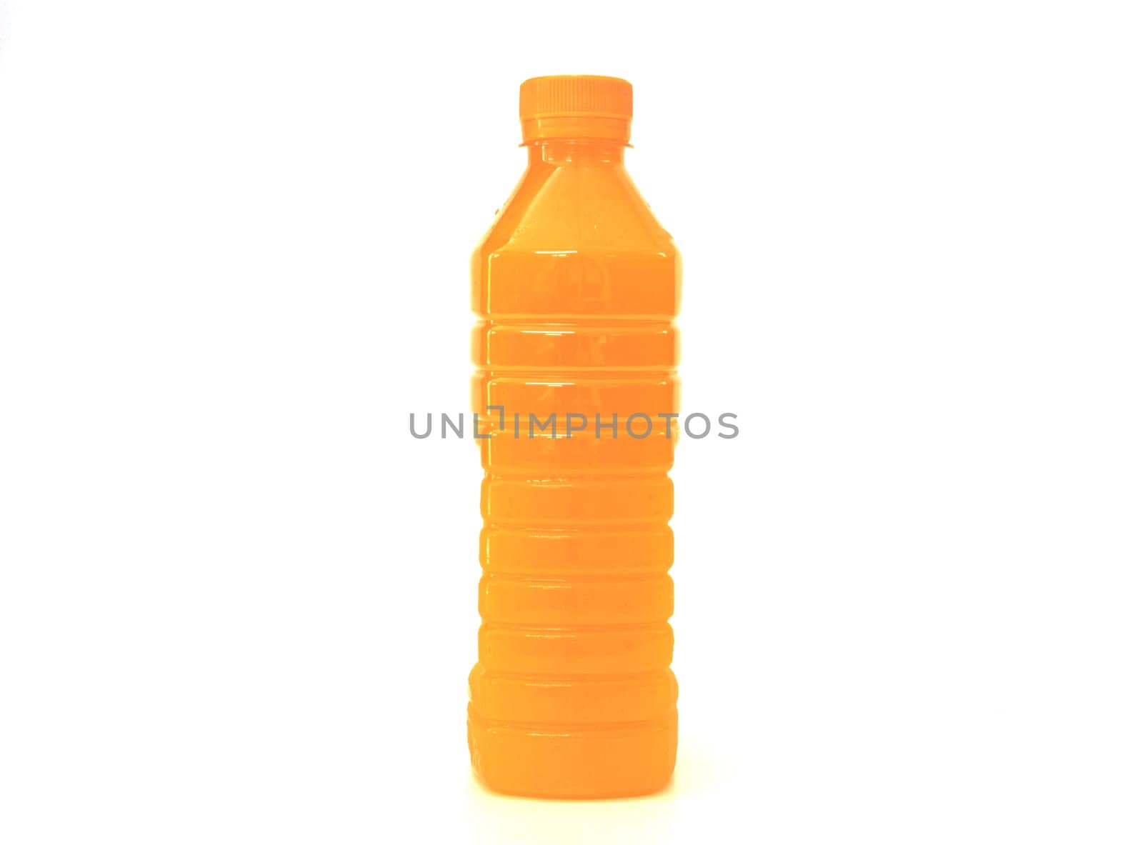 orange juice in plastic bottle on background