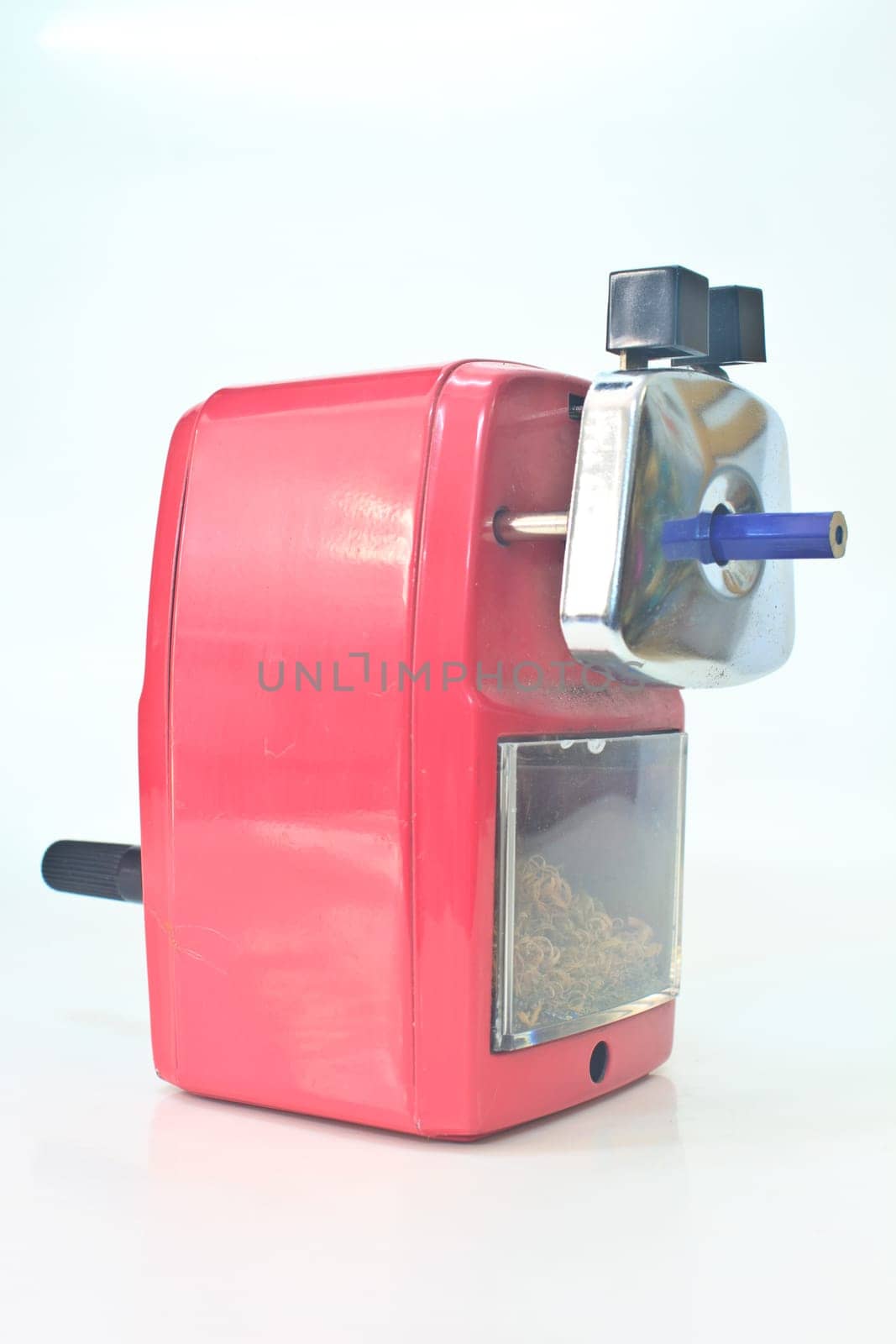 red pencil sharpener on white background