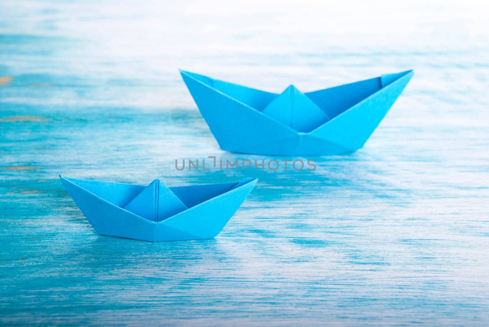 Two blue Origami Boats in the Sea, Nautical Background