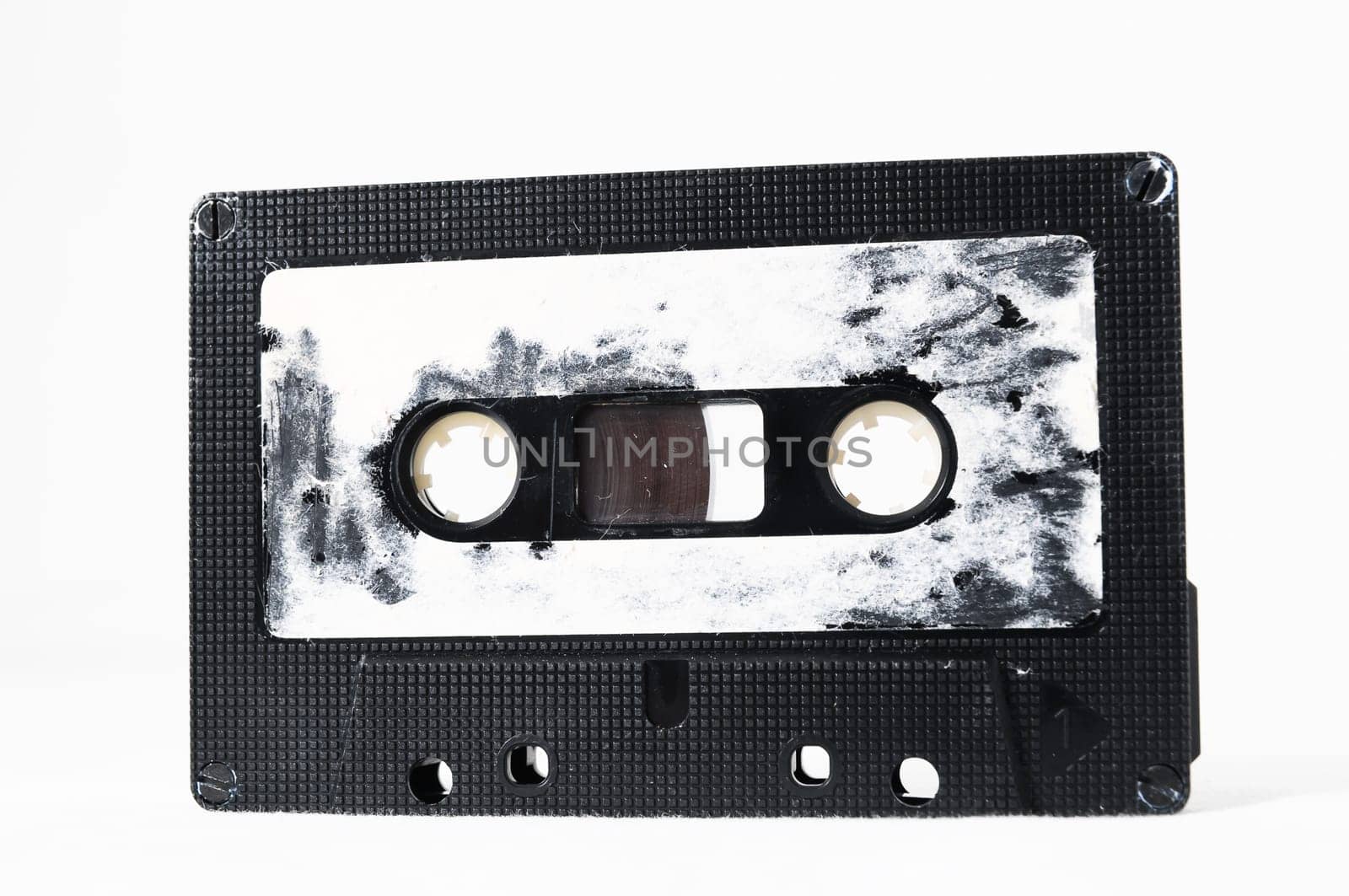 Ancient Vintage Used Musicassette over a White Background