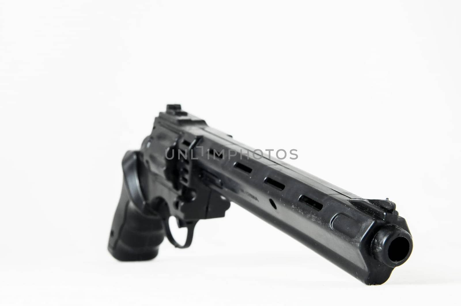 Black Revolver Pistol Gun on a White Background