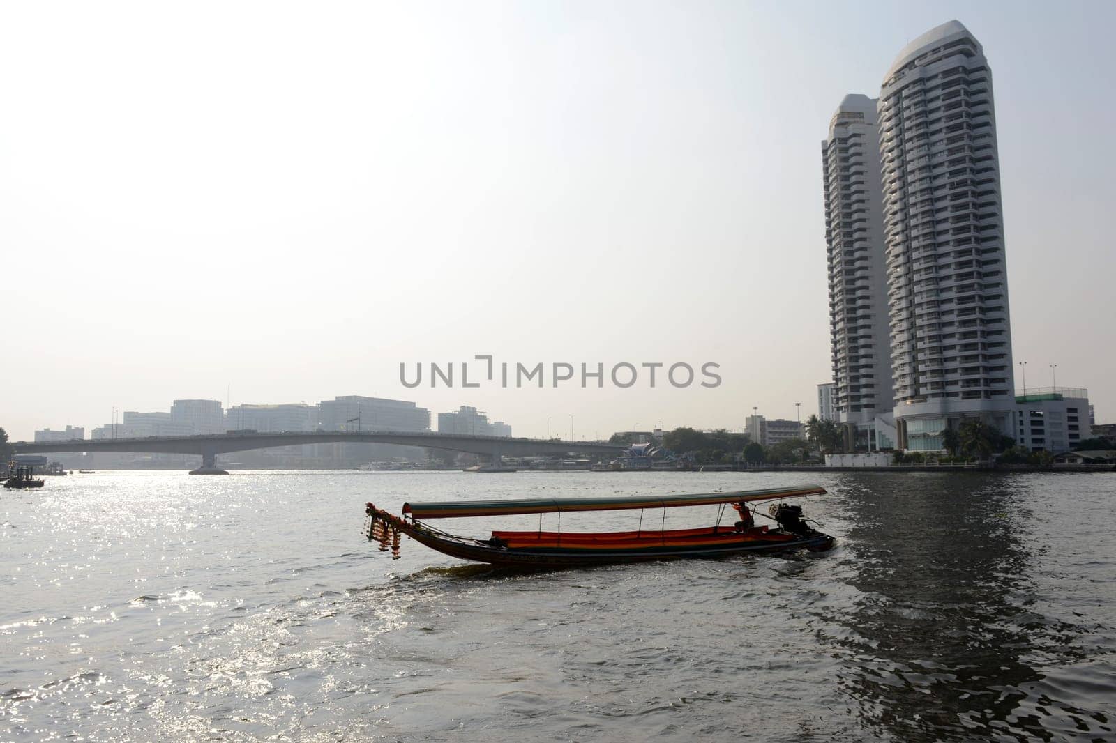 A traditional wooden boat on the Mae Nam Chao Phraya River in the capital Bangkok of Thailand in South East Asia.