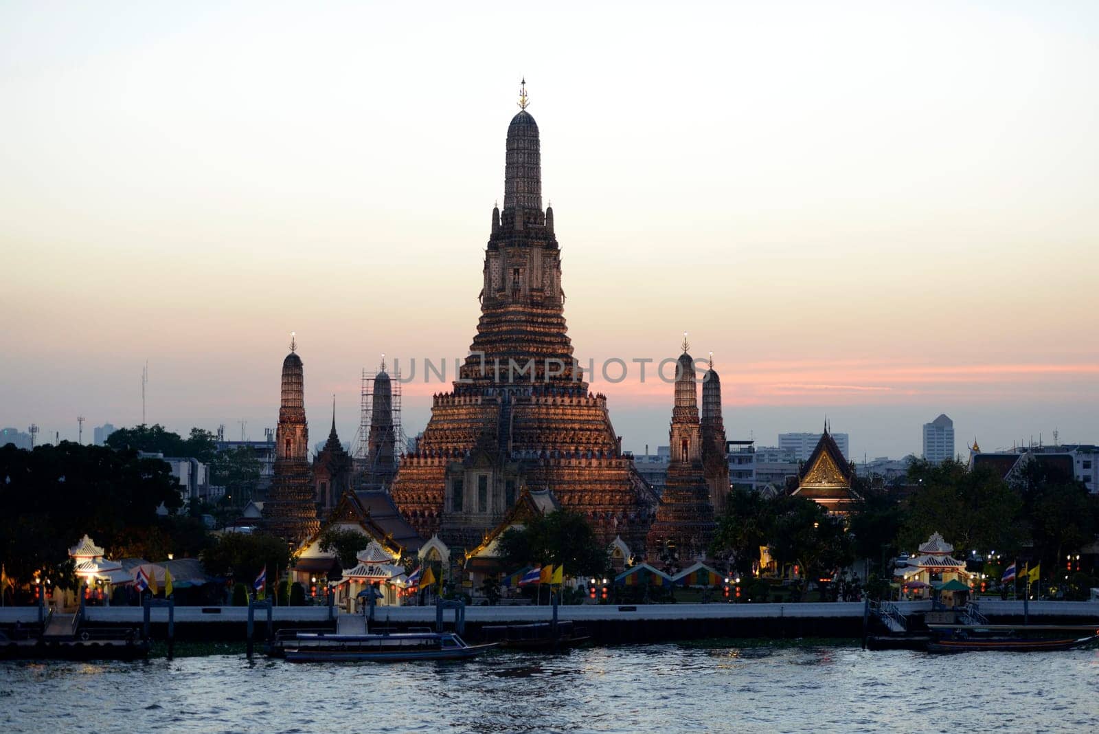 The temple complex of Wat Arun on the Mae Nam Chao Phraya River in the capital Bangkok of Thailand in South East Asia.
