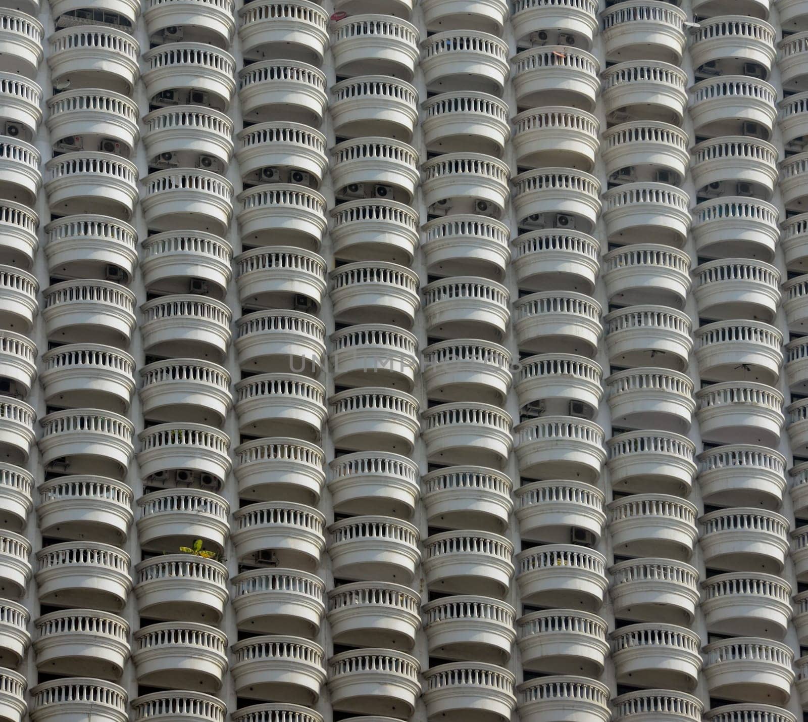 A skyscraper with many balconies on the Mae Nam Chao Phraya River in the capital Bangkok of Thailand in South East Asia.