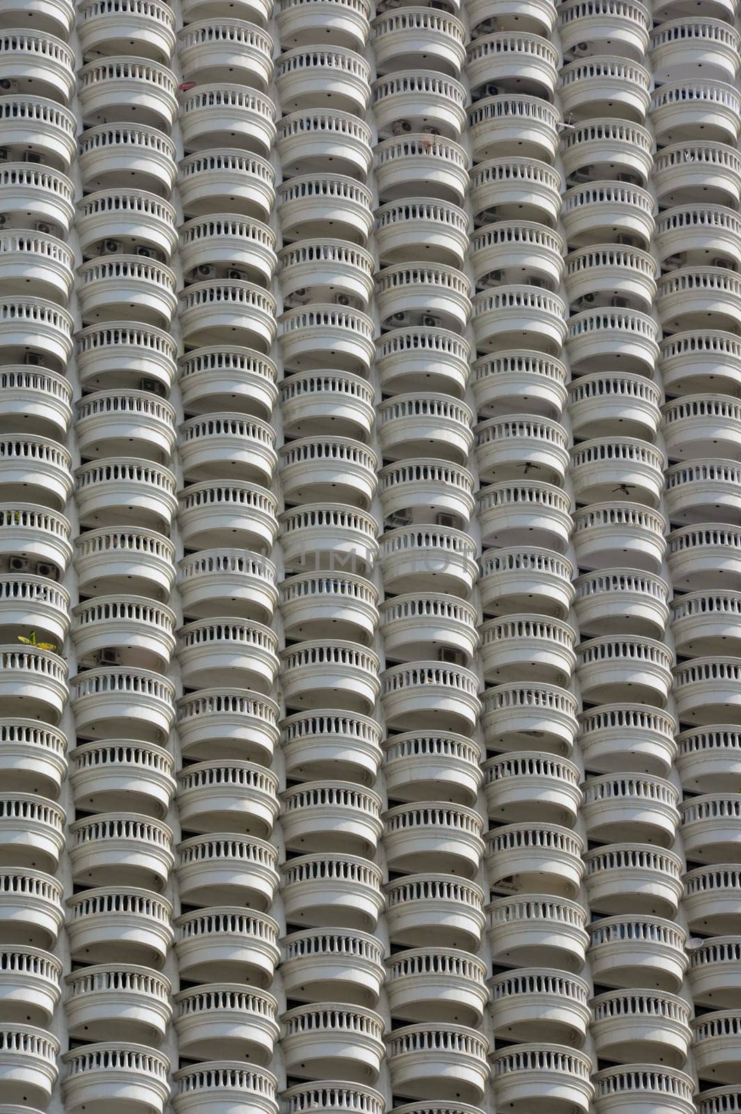 A skyscraper with many balconies on the Mae Nam Chao Phraya River in the capital Bangkok of Thailand in South East Asia.