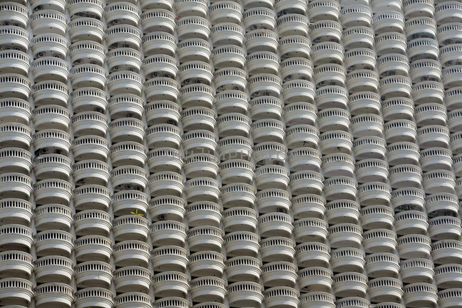 A skyscraper with many balconies on the Mae Nam Chao Phraya River in the capital Bangkok of Thailand in South East Asia.