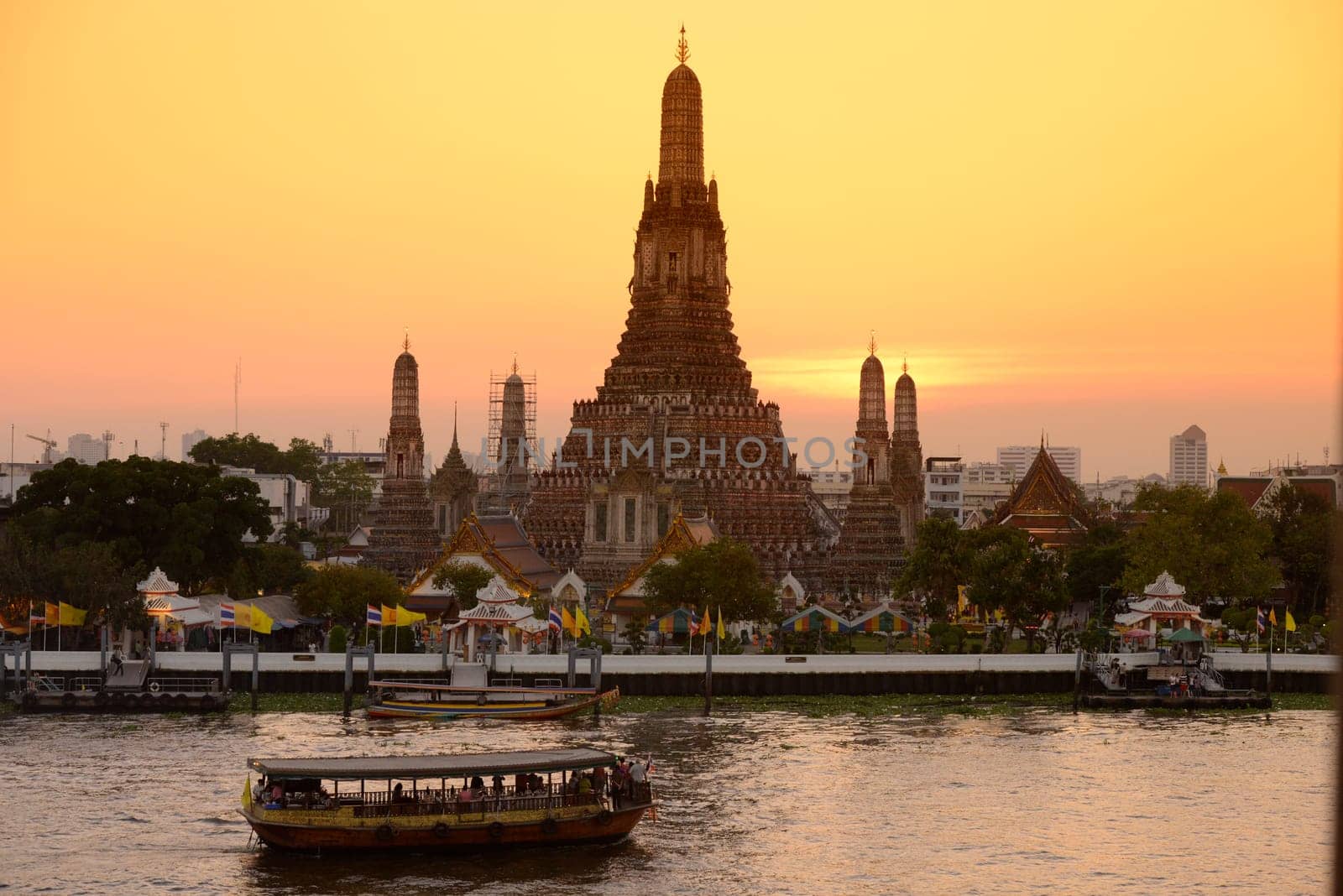 The temple complex of Wat Arun on the Mae Nam Chao Phraya River in the capital Bangkok of Thailand in South East Asia.