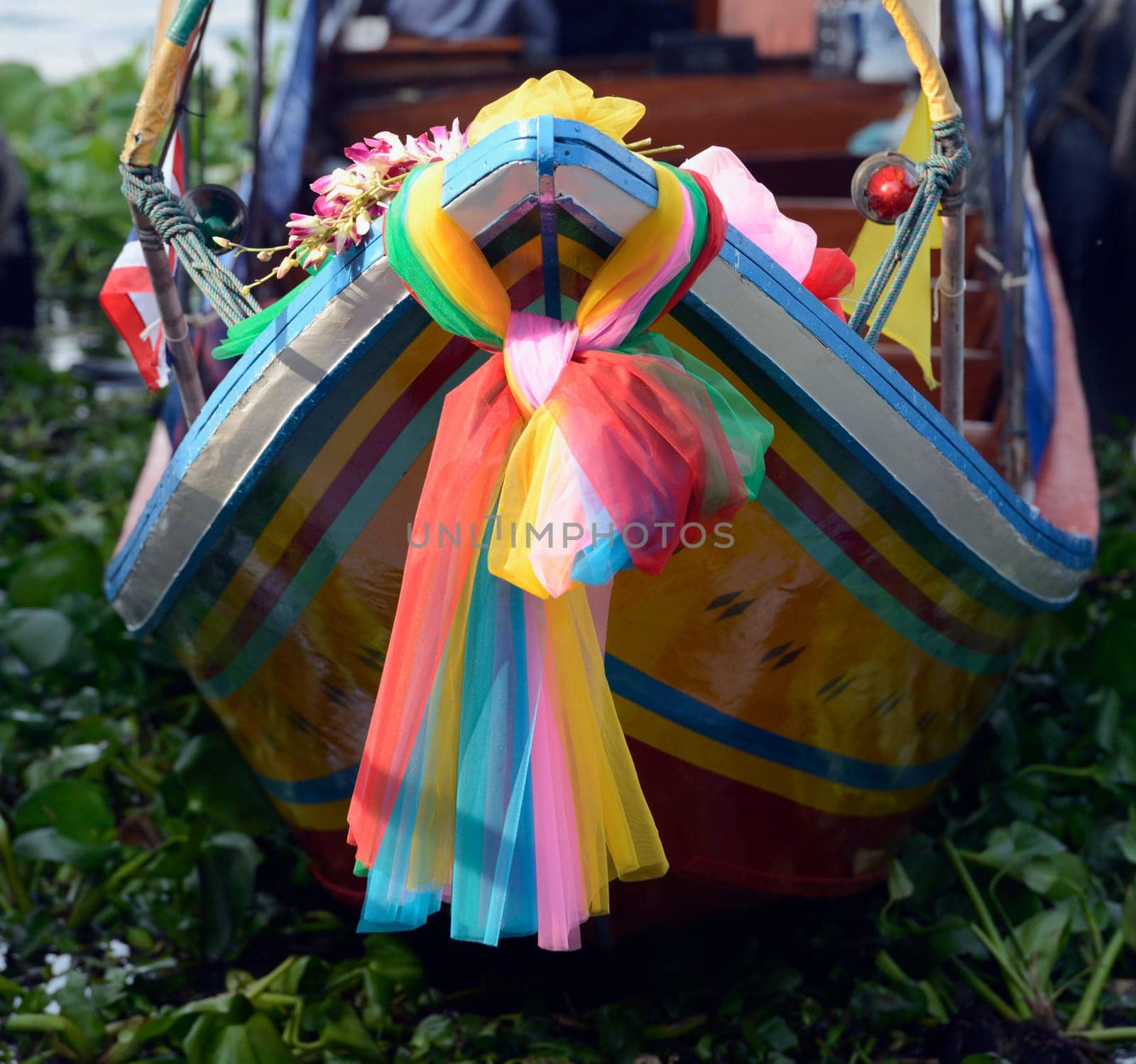 A traditional wooden boat on the Mae Nam Chao Phraya River in the capital Bangkok of Thailand in South East Asia.