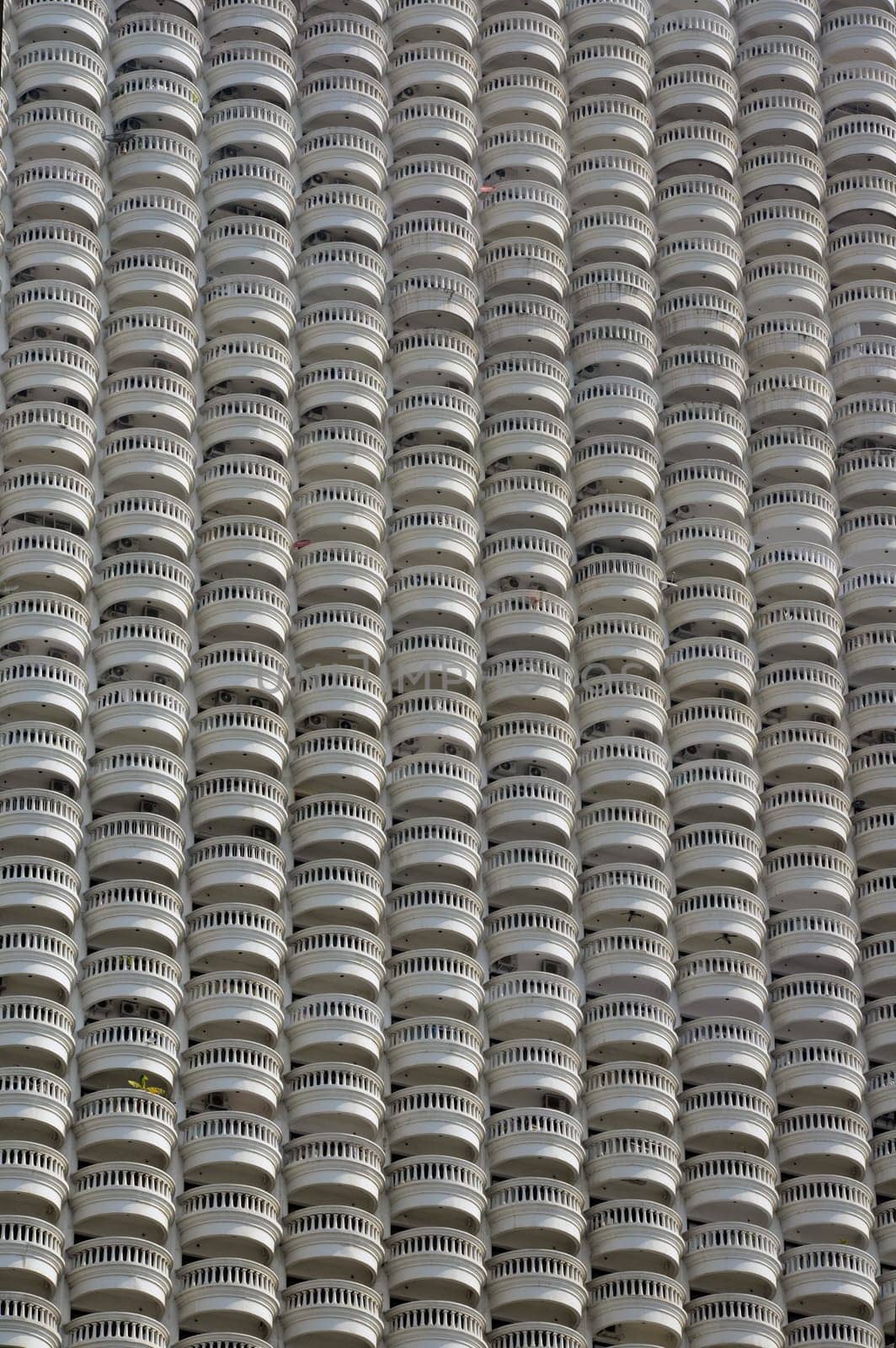 A skyscraper with many balconies on the Mae Nam Chao Phraya River in the capital Bangkok of Thailand in South East Asia.
