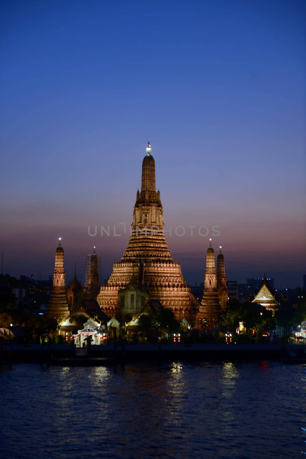 The temple complex of Wat Arun on the Mae Nam Chao Phraya River in the capital Bangkok of Thailand in South East Asia.
