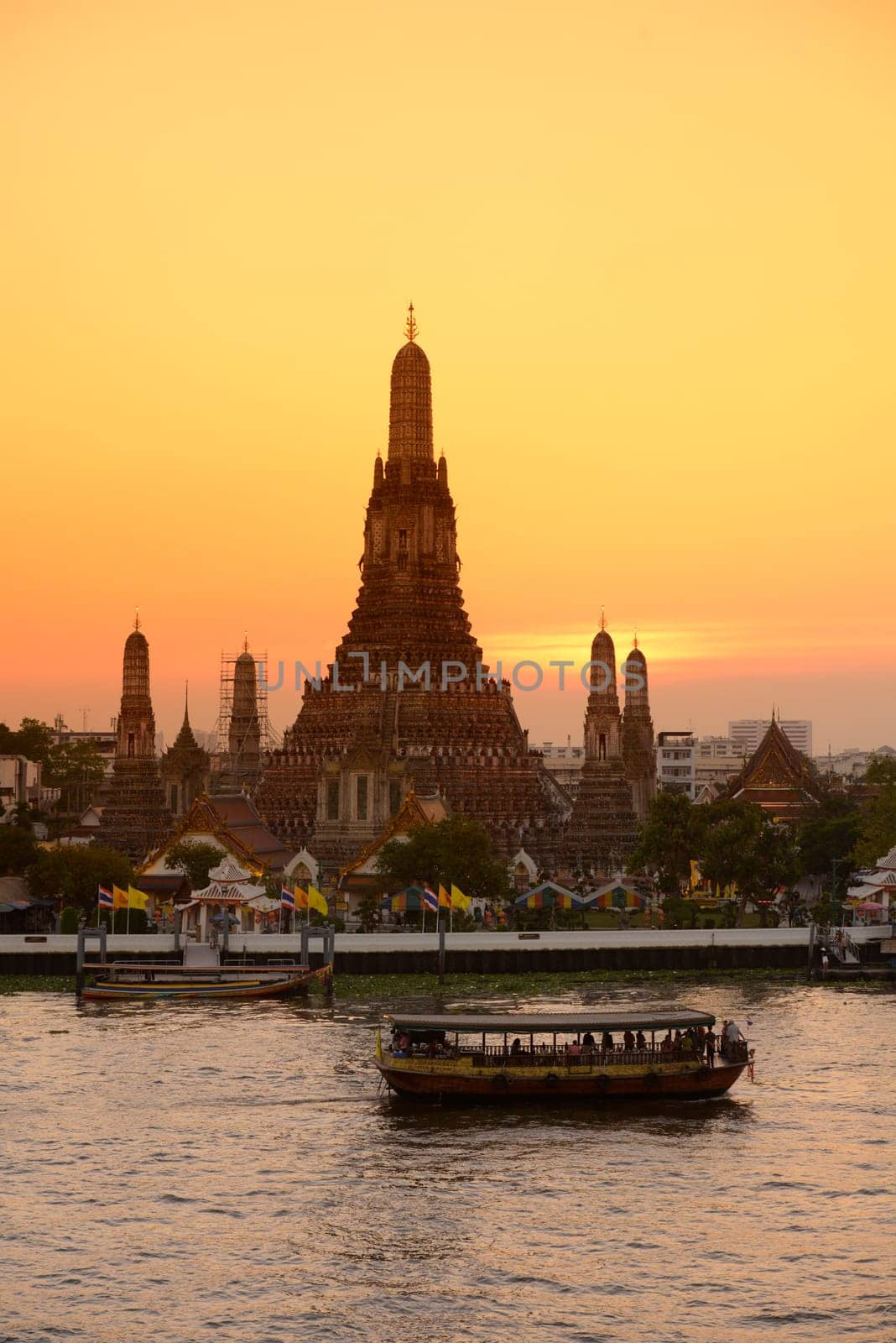 The temple complex of Wat Arun on the Mae Nam Chao Phraya River in the capital Bangkok of Thailand in South East Asia.