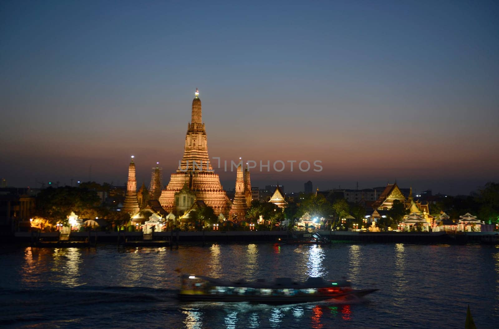 The temple complex of Wat Arun on the Mae Nam Chao Phraya River in the capital Bangkok of Thailand in South East Asia.