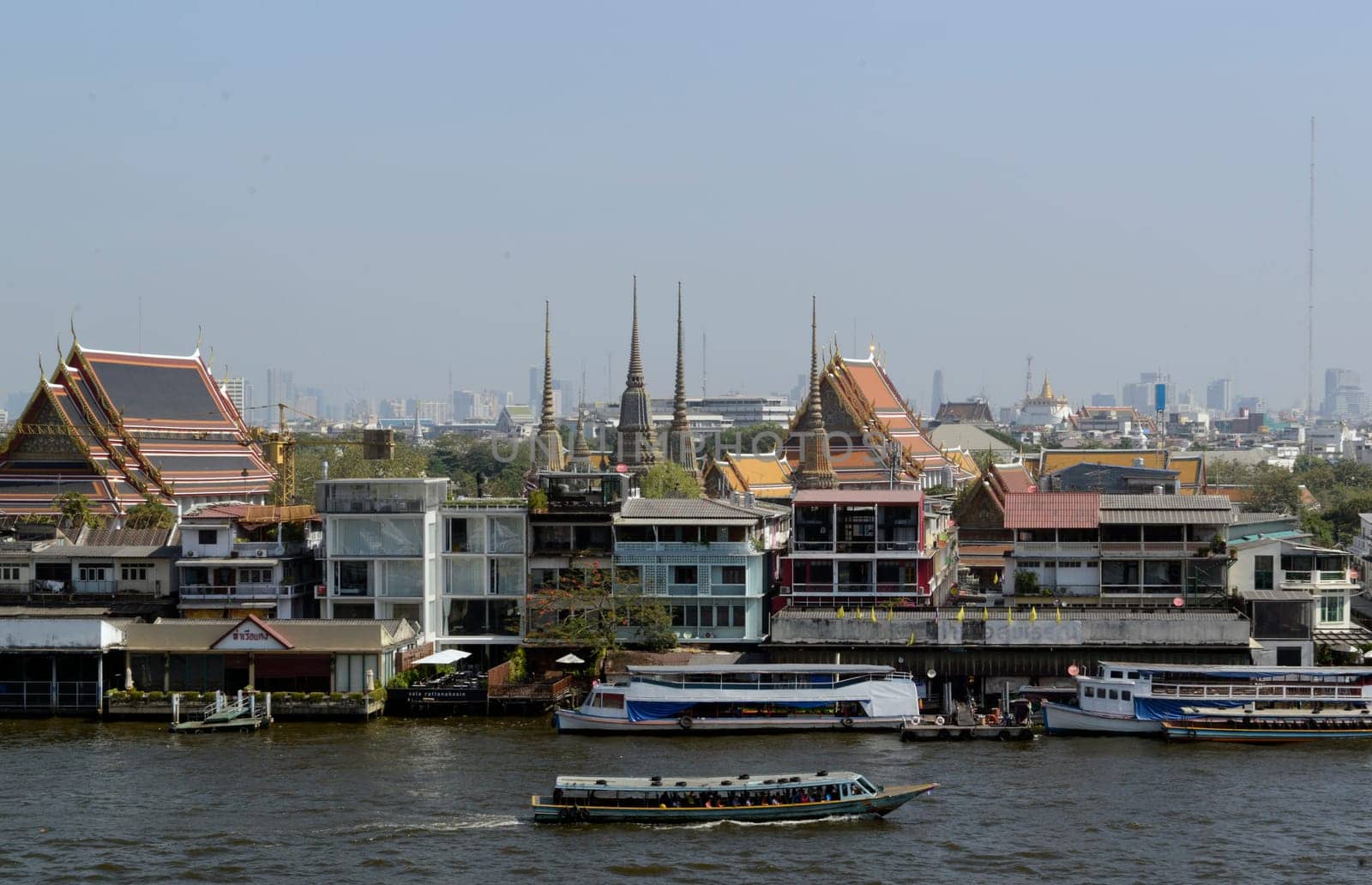 The temple complex of Wat Arun on the Mae Nam Chao Phraya River in the capital Bangkok of Thailand in South East Asia.
