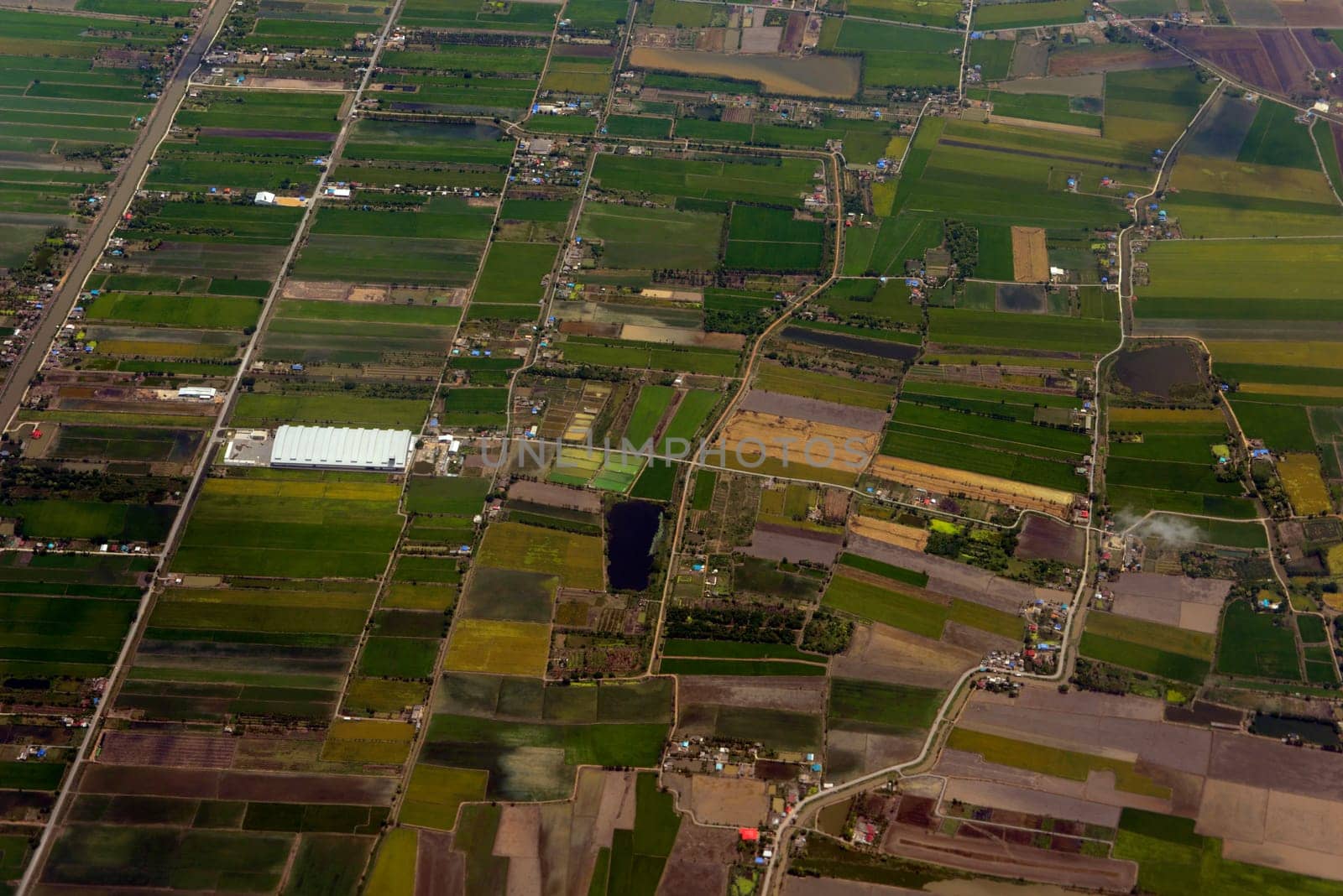 View from a plane on the flight over Chiang Mai in the north of Thailand in South East Asia.