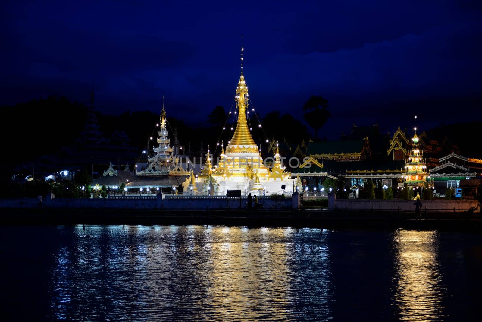 The Wat Jong Kham and Jong Klang temple on Lake Nong Jong Kham in the village of Mae Hong Son in northern Thailand in South East Asia.