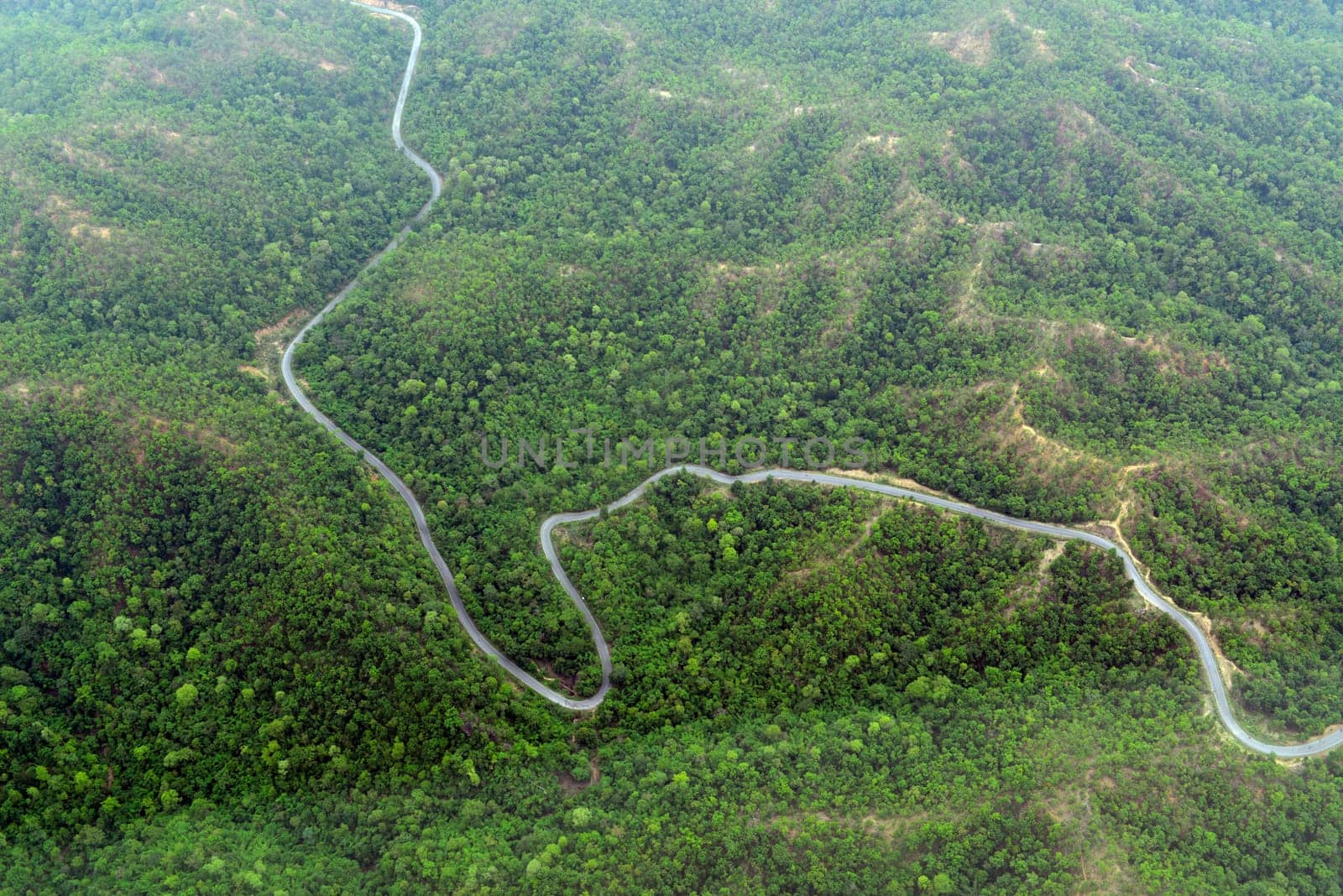 The landscape with the mountain road between Mae Hong on and pai in the mountain oust of Mae Hong Son in the north of Thailand in South East Asia.