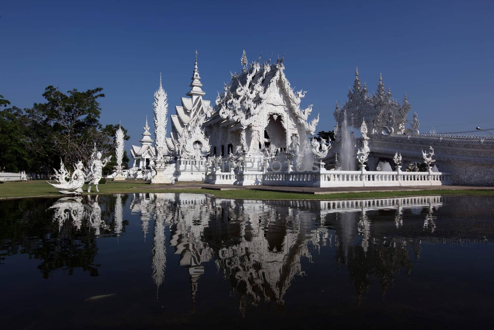 The temple Wat Rong Khun 12 km south of Chiang Rai in the province of chiang Rai in the north of Thailand in South East Asia.