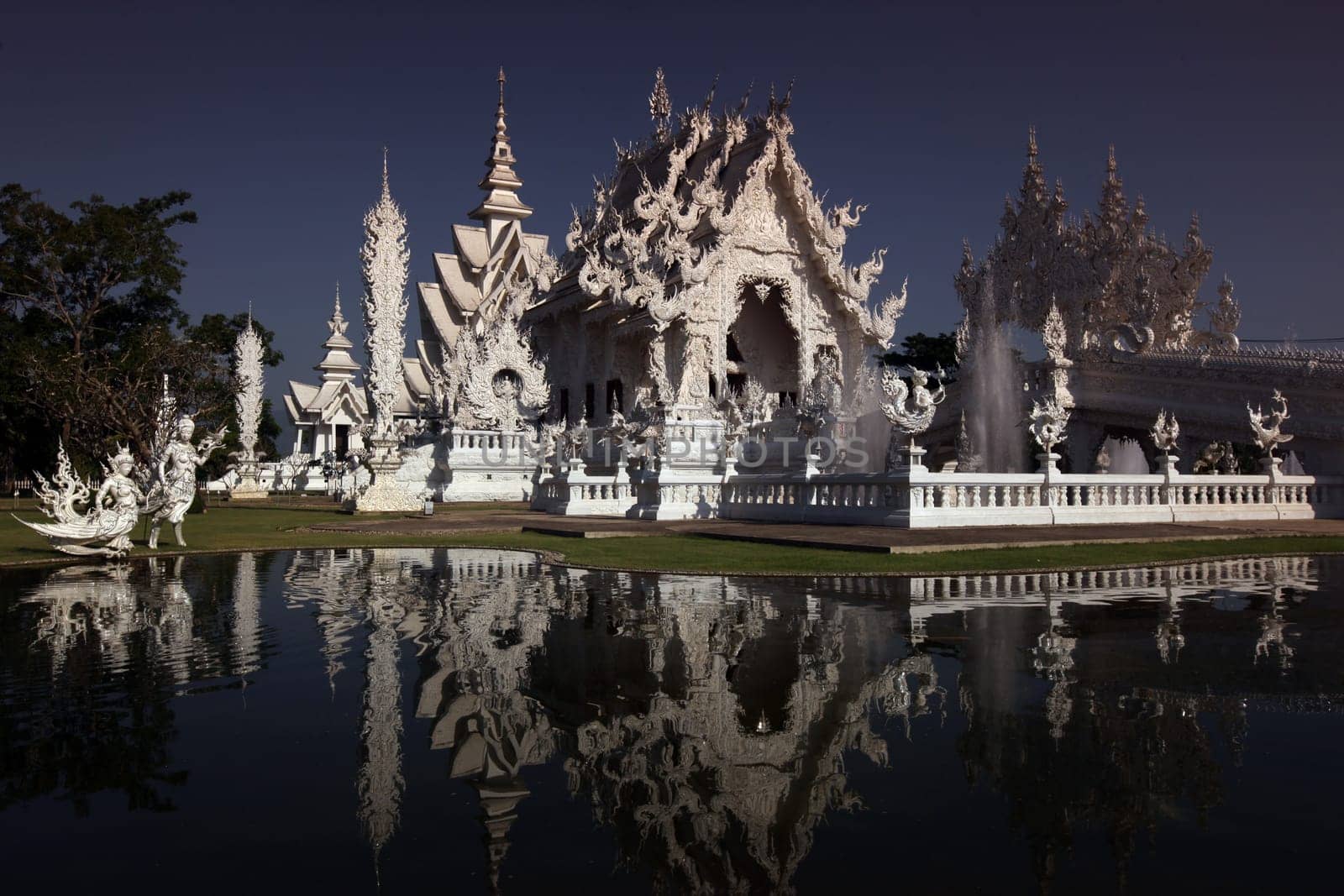 The temple Wat Rong Khun 12 km south of Chiang Rai in the province of chiang Rai in the north of Thailand in South East Asia.