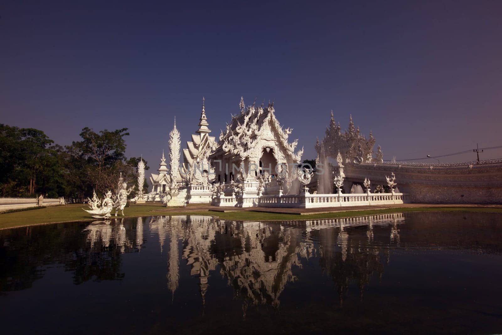 The temple Wat Rong Khun 12 km south of Chiang Rai in the province of chiang Rai in the north of Thailand in South East Asia.