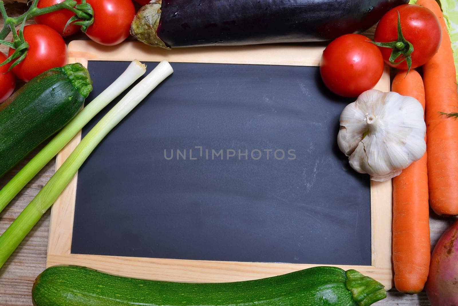 Table of fresh vegetables on wooden board