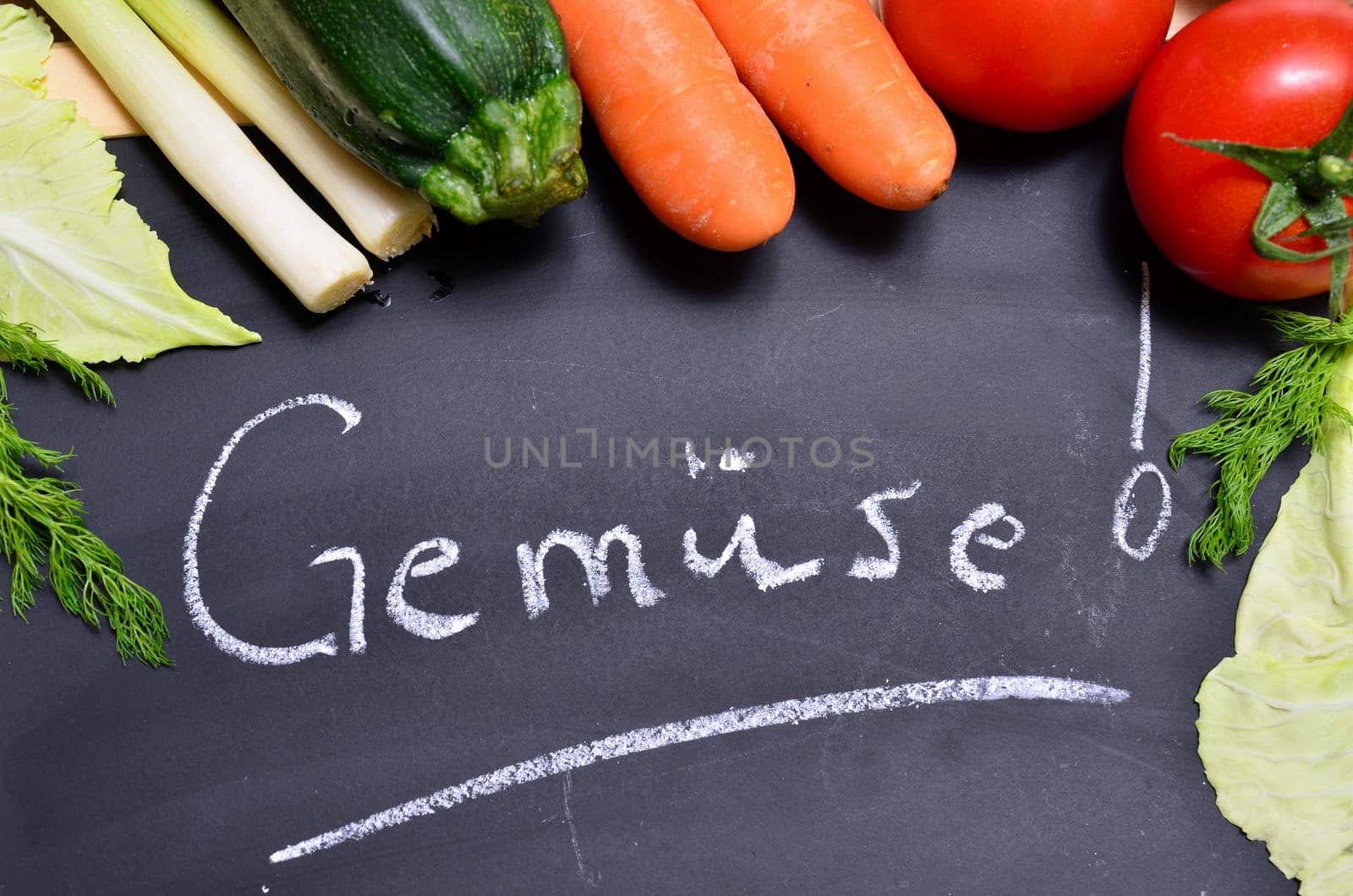 Table of fresh vegetables on wooden board